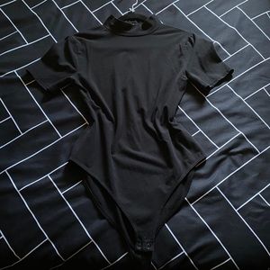 Turtle neck bodysuit.